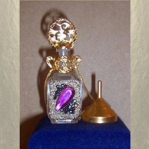 Collier fiole à parfum plaqué or dans écrin modèle 33