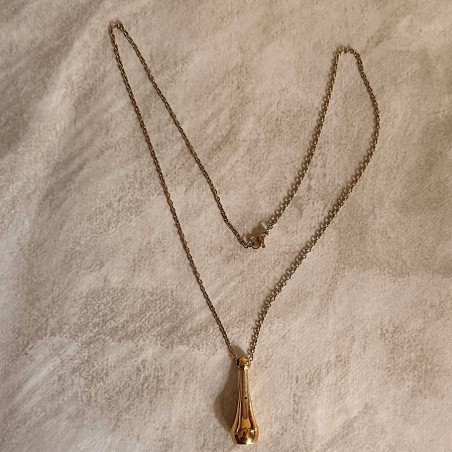 Fiole pendentif  diffuseur de parfum Acier inoxydable 316L or posée